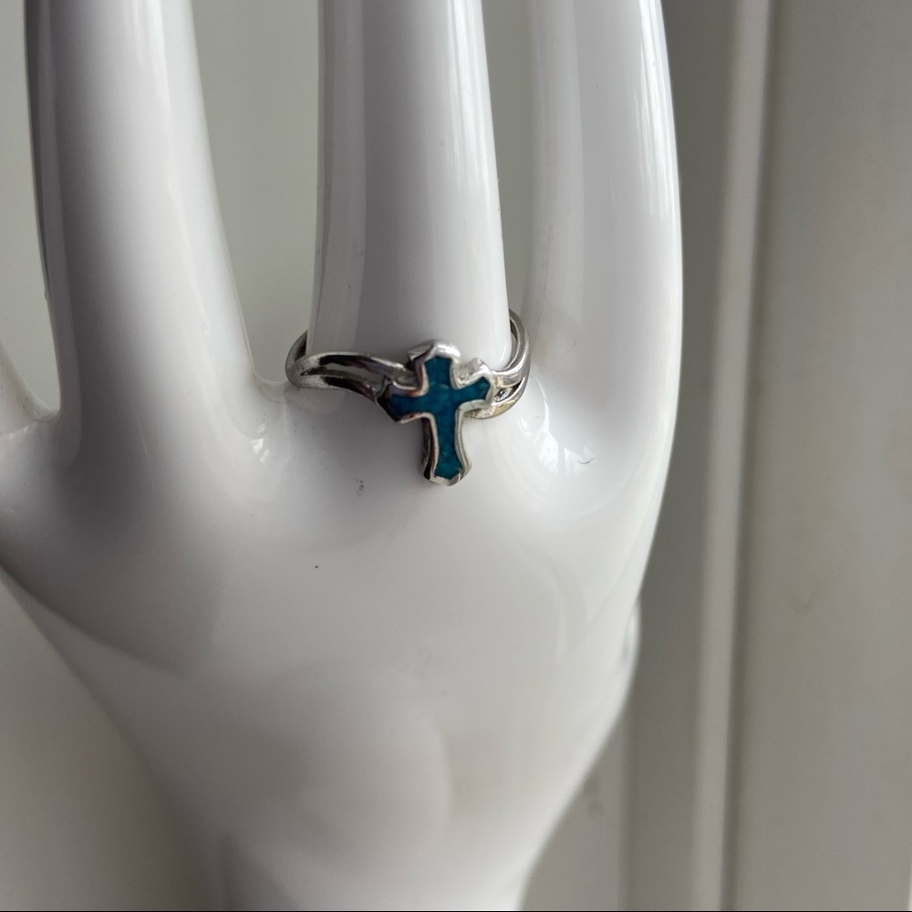 Silver tone women faux turquoise cross ring. Size 5.5. Good used condition.